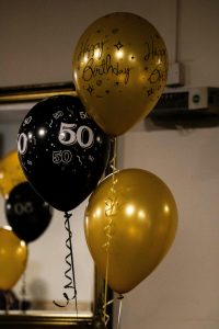 50th birthday balloons, celebrating turning 50 and planning a second income stream after 50